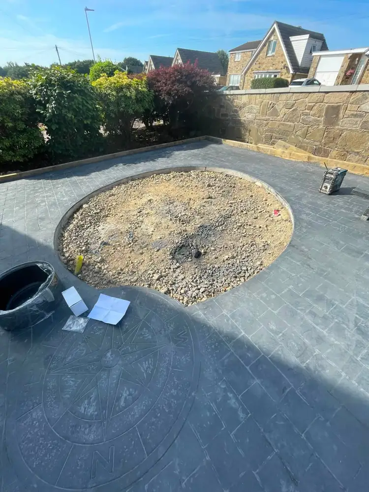 Before: patio with empty circular bed